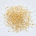 Detailed macro shot of 18K gold plated ball head pins for DIY jewelry making and crafts - Extended Version / 18K Gold