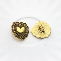 Detailed macro view of vintage gold heart metal button for DIY jewelry and sewing - Large / Gold