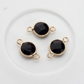 Detailed view of three faceted black gemstone connectors with gold-plated bezel for DIY jewelry - Black