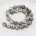 Macro detail of silver plated round lava stone beads with porous texture for DIY jewelry - 13*6mm 1pc / White K/Silver