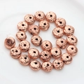 Macro view of rose gold electroplated lava rock beads with porous texture for DIY jewelry - 13*6mm 1pc / Rose Gold