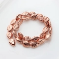 Detailed view of rose gold electroplated teardrop volcanic stone beads for DIY jewelry - 14x10mm / Rose Gold