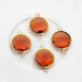 Macro detail of amber faceted crystal pendants with gold edges and double hooks - Brown