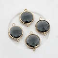 Macro detail of 16mm black faceted crystal connectors in golden copper frames - Dark Blue
