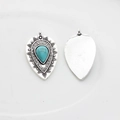 Detailed front and back view of teardrop resin charms with sky blue texture and silver base - Turquoise