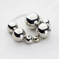 Macro view of mirror-polished silver spacer beads in various sizes for DIY jewelry making - 10mm / Silver