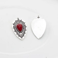 Detailed close-up of Bohemian alloy teardrop pendants with red resin stone in retro silver - Red Turquoise