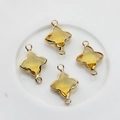 Detail of yellow crystal clover charms with gold plated borders and double rings for DIY - Gold