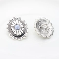 Detailed view of vintage alloy concho with blue stone inlay and sewing loops on the back - White