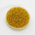 Macro detail of 2mm bright yellow glass seed beads for DIY jewelry making and craft projects - Pack Of 10g / Lemon Yellow