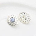 Macro shot of silver alloy flower buttons with white faux stone and sewing loop - White Turquoise