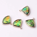 Macro detail of four fan-shaped gold-rimmed crystal glass pendants for DIY jewelry making - Iridescent Green (10)