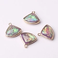 Detailed view of four purple fan-shaped crystal pendants with golden metal frames for DIY jewelry - Iridescent Purple (09)