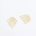 Close-up of geometric leaf shape matte alloy pendant charms with top hanging loops - Off White