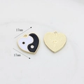 Macro detail of 17mm heart-shaped Yin Yang charm showing front enamel and back texture - Black Heart