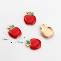 Detail of red apple alloy charms for jewelry making with size dimensions 14x11mm - 14mm x 11mm / Apple