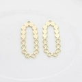 Detail of two golden hollow oval pendants with metallic bead edges for DIY jewelry making - Gold