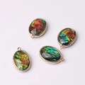 Colorful oval glass crystal pendants with gold engraved metal frames and glitter details - Iridescent Red (01)
