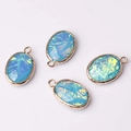 Set of four oval blue opal-effect pendants with engraved golden metal borders - Opal Blue (04)