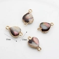 Dettaglio di pendenti in perle barocche a forma di cuore 16x10mm con bordo dorato - Stile Cuore (01)