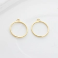 Close-up of minimalist golden alloy hollow circle charms for DIY earring making - Small