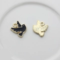 Detail of bird charms featuring black enamel front and textured gold alloy back - Black