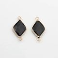 Macro detail of rhombus natural stone pendant with gold edges and double bail connectors - Black Stone (06)