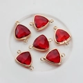 Macro view of six red faceted triangle crystal pendants with gold plated double loops - Red