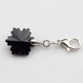 Macro shot of 14mm black snowflake pendant with silver lobster clasp for DIY projects - Black
