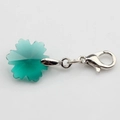 Close-up of a 14mm green crystal snowflake pendant with a silver lobster clasp for DIY crafts - Peacock Green