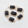 Detailed view of six black crystal rectangular pendants with gold-plated double loops - Black