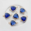 Macro detail of faceted blue crystal triangle charms with gold plated double rings - Dark Blue