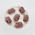 Detailed view of six rectangular purple crystal pendants with gold metal hanging loops - Medium Purple