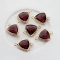 Macro detail of burgundy triangular crystal connectors in gold-plated copper frames - Medium Purple