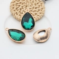 Green teardrop crystal pendant with gold metal frame showing front and back details - Dark Green