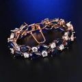 Elegante bracciale in oro rosa con zirconi blu a goccia e cristalli bianchi tondi - 17cm / Oro Rosa Blu Zaffiro