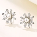 Elegant silver daisy stud earrings featuring white zircons and center pearls for women - Silver