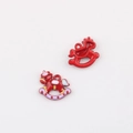 Close-up of red enamel rocking horse charms for DIY jewelry making and pendants - Red Unicorn