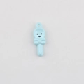 Detail of sky blue smiley face spoon charm with a 3D bow for DIY jewelry making - Blue