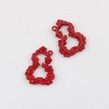 Detailed macro view of red matte alloy flower pendant with red zircon inlay details - Red Red Rhinestone