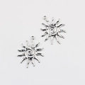 Detailed view of two silver-colored sunflower pendants with spiral center and ray design - Silver 40*33mm
