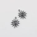 Macro view of vintage style alloy sun charms with spiral patterns for jewelry making - Gun Black 24*19mm