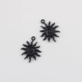 Macro detail of black sunflower charms with spiral centers and rings for DIY jewelry - Black 24*19mm