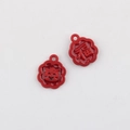 Detail of red floral charm pendants with Chinese Fu character and cute cartoon mascot - Red