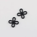 Close-up of a glossy black alloy Chinese knot pendant for DIY jewelry making - Black
