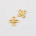 Macro detail of matte gold alloy Chinese knot pendants for DIY jewelry making - Matte Gold