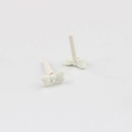 Detail of cream white bow earring charms with matte finish and loop for DIY jewelry - White
