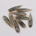 Natural agate stone teardrop pendant with gold wavy metal border and textured finish - Grey & Black
