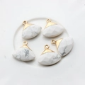 Detailed view of five fan-shaped white marble pendants with gold-plated metal edges - White