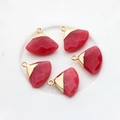 Detail of five fan-shaped red faceted gemstones with elegant gold metal edge plating - Red